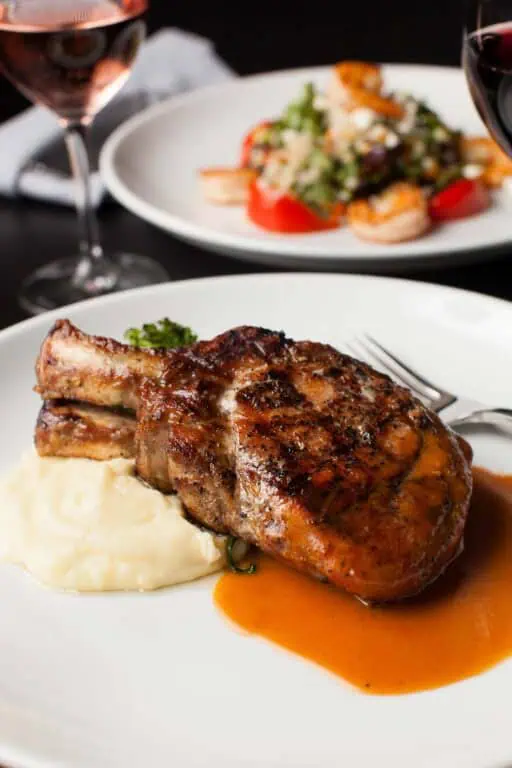 Grilled pork chop with mashed potatoes and sauce