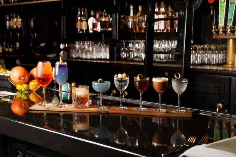 Variety of colorful cocktails on a bar counter.